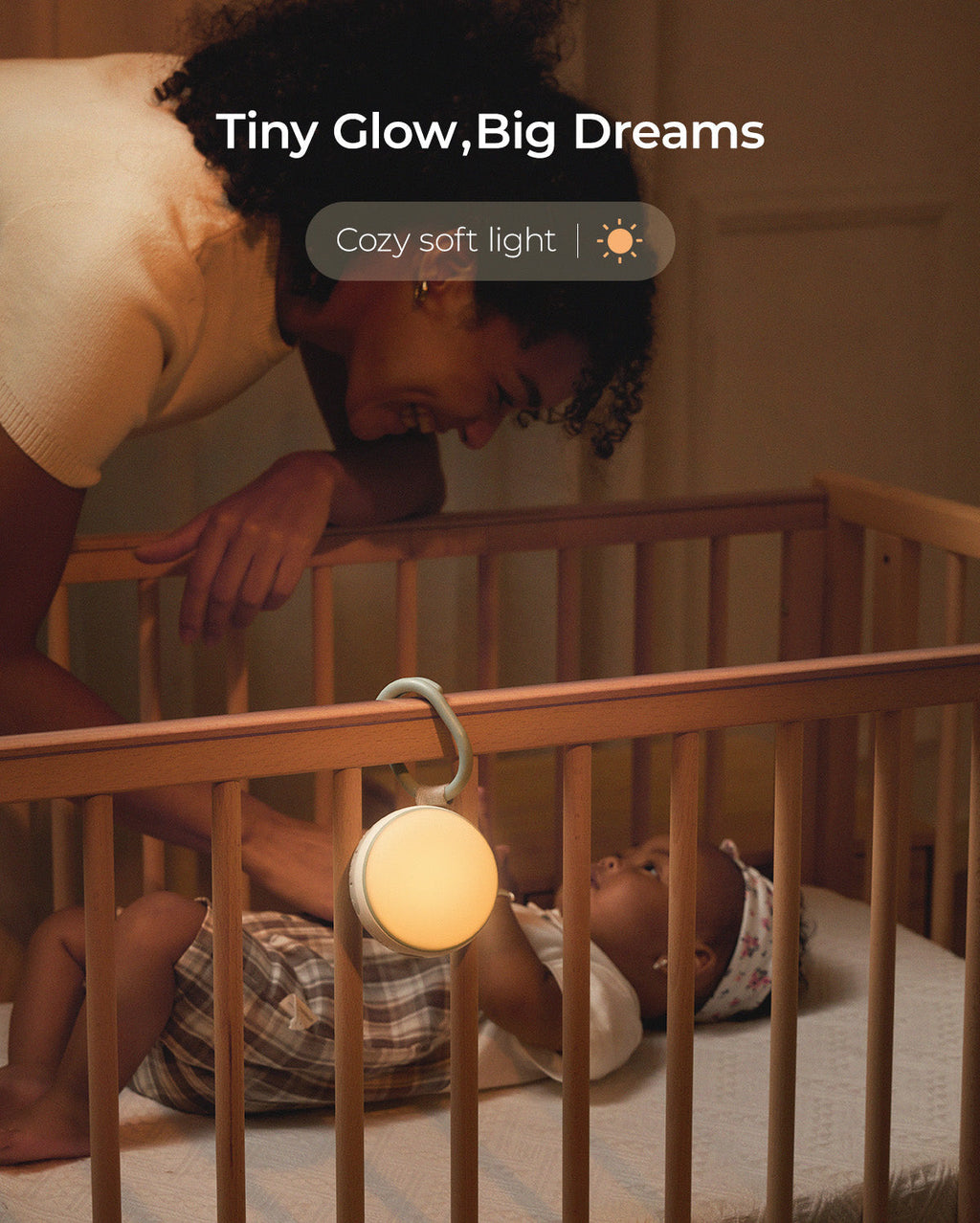 Momcozy portable sound machine with soft, warm light, promoting Tiny Glow, Big Dreams. Soft light and sounds to soothe baby.